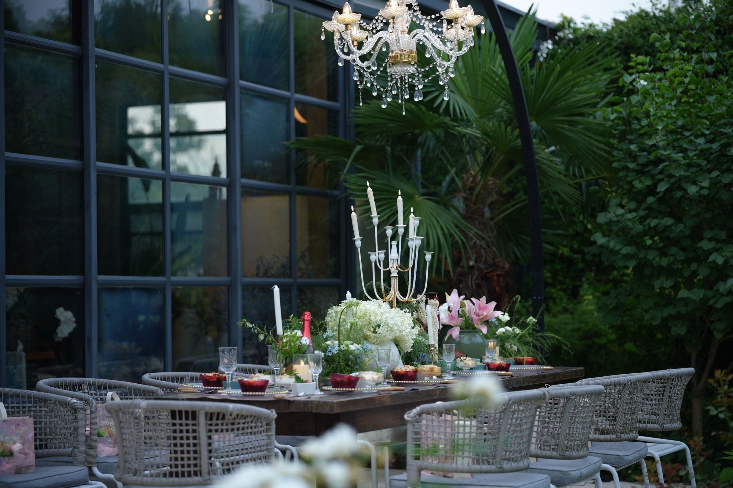 A garden table laid for a celebration as the light goes